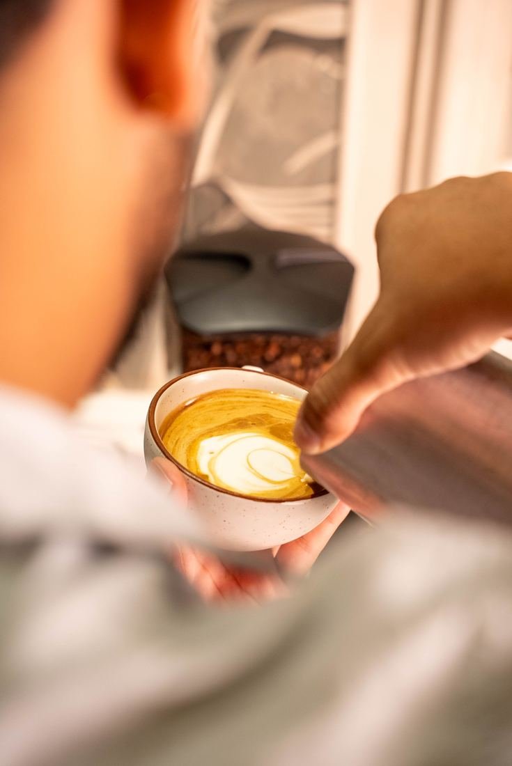 Barista pouring latte art